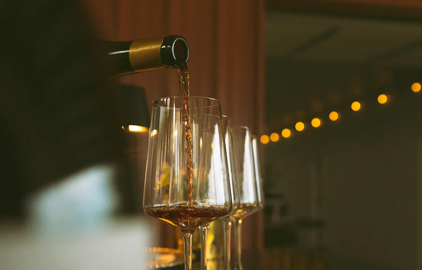 Nabors Creek wine being poured in to a glass at a private event.